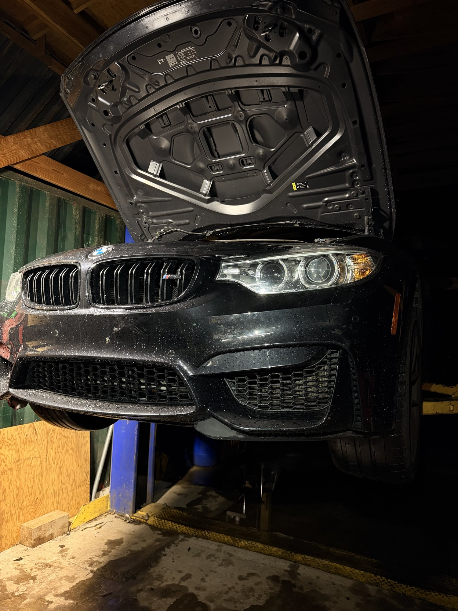 BMW raised on the lift in the bay